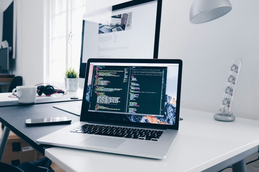 Developer workspace with code on screen representing Elementor CSS troubleshooting